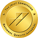 Gold medal badge with a diagonal stripe and the words 'International Quality Award' around the rim of the circle.