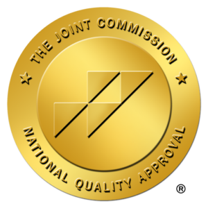 The Joint Commission National Quality Approval gold seal, symbolizing healthcare accreditation and quality standards.